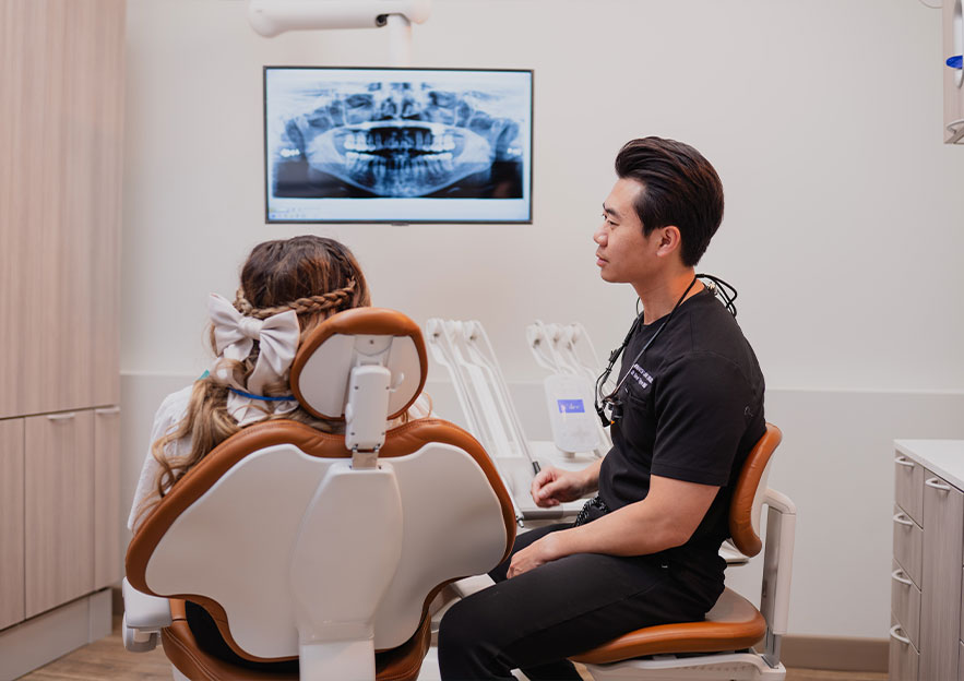 Dr. David Nguyen with Patient | Monarch Landing Dental | Calgary, AB